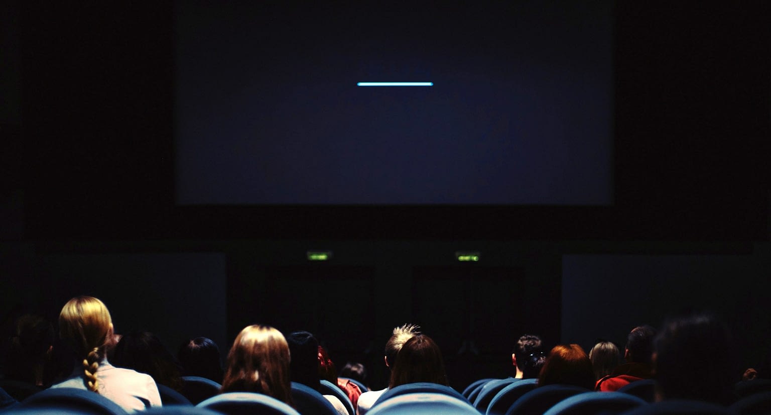 people watching a film